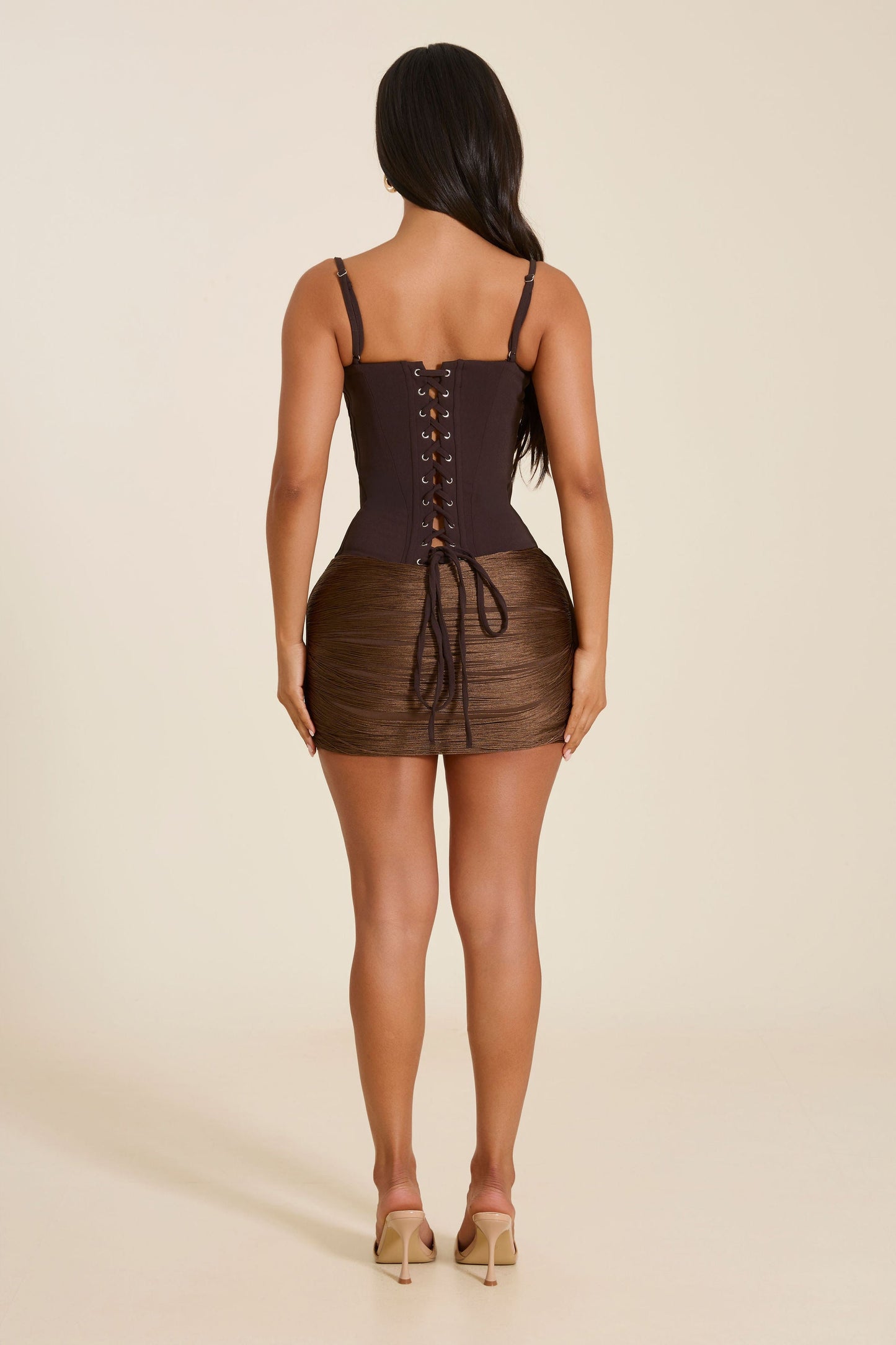 The Jordyn Tassel Mini Skirt in Brown