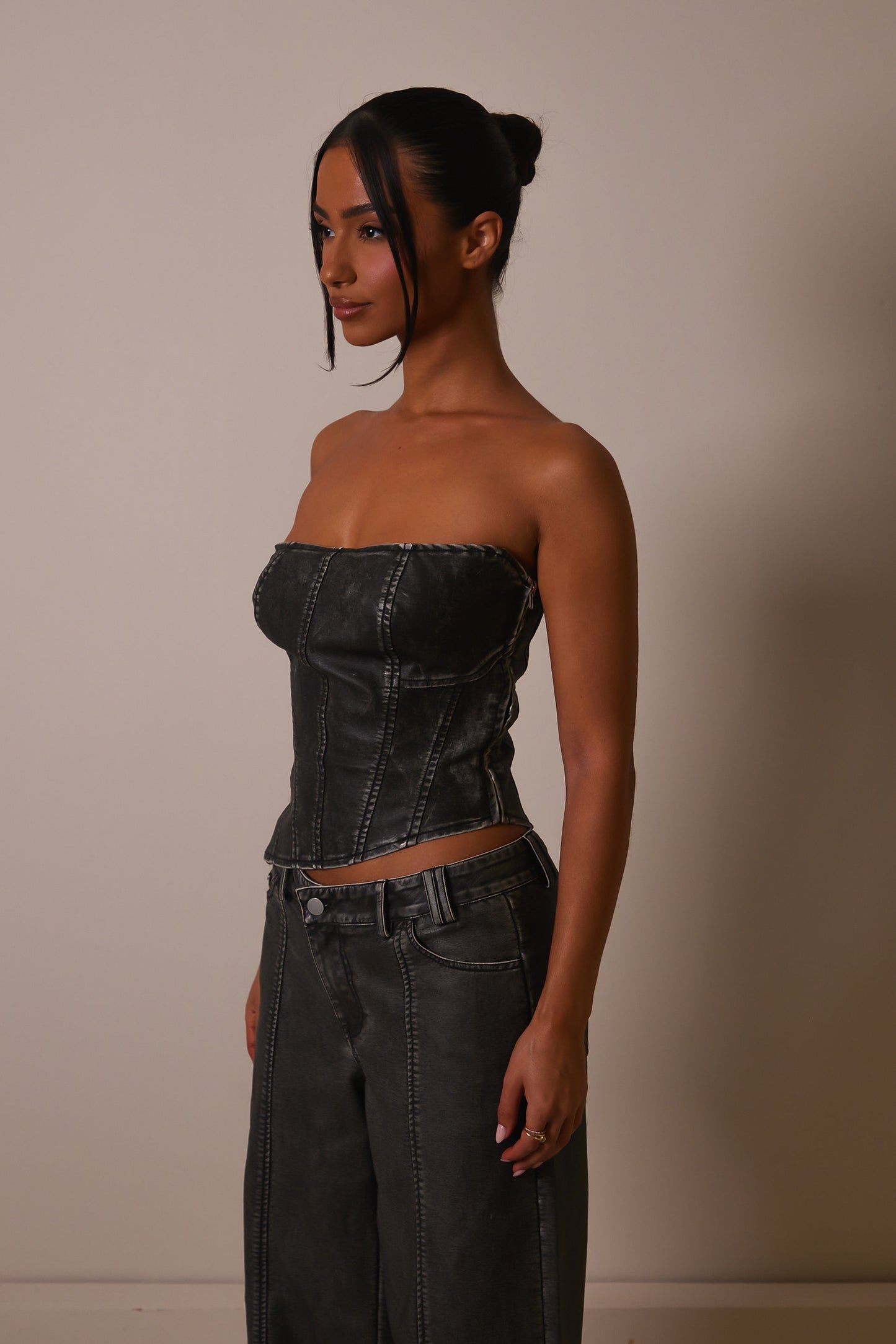 The Distress Wash Asymmetric Leather Corset in Dark Wash